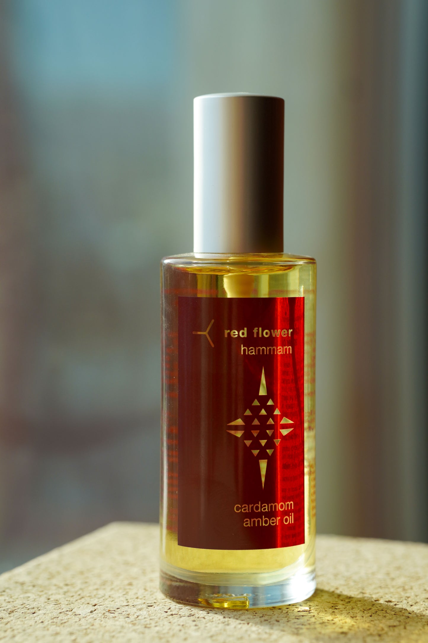 red flower Hammam Cardamom Amber Oil